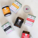 Collection of home fragrance products with visible branding on a white background