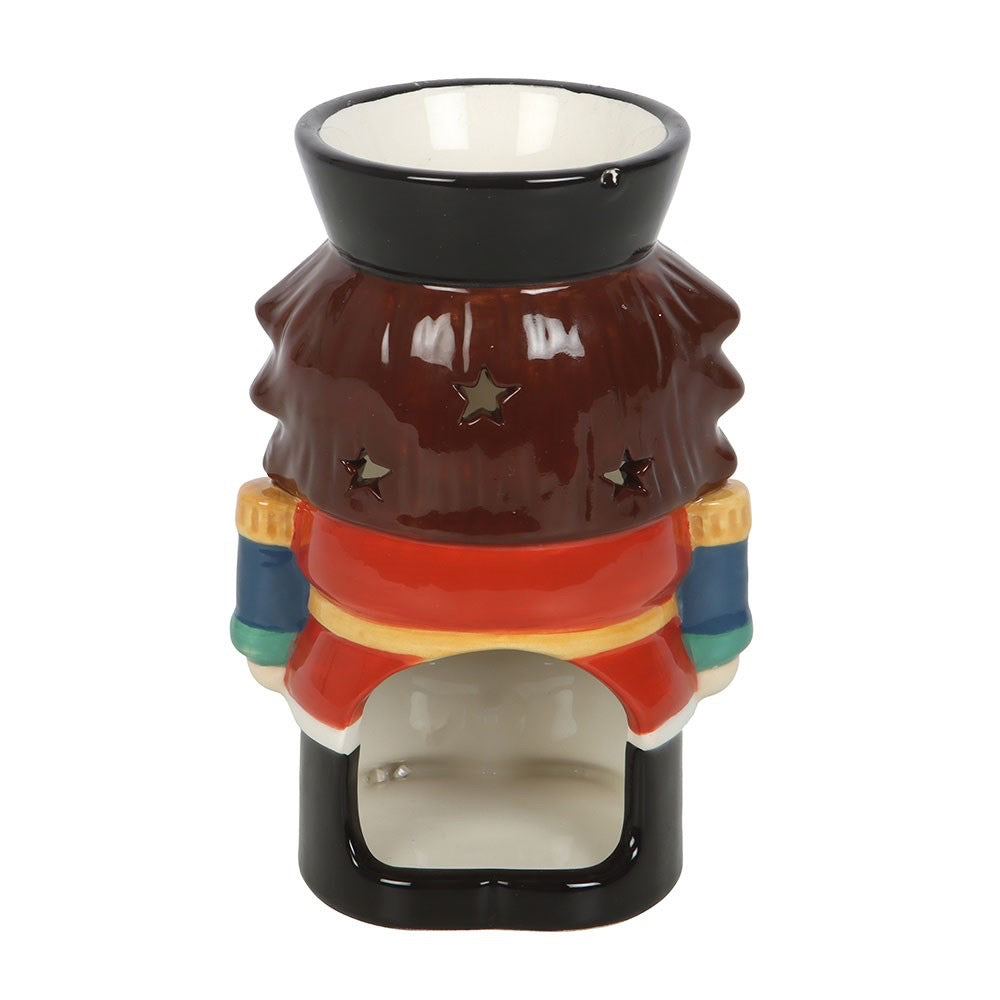 Ceramic oil burner with colorful design on a white background